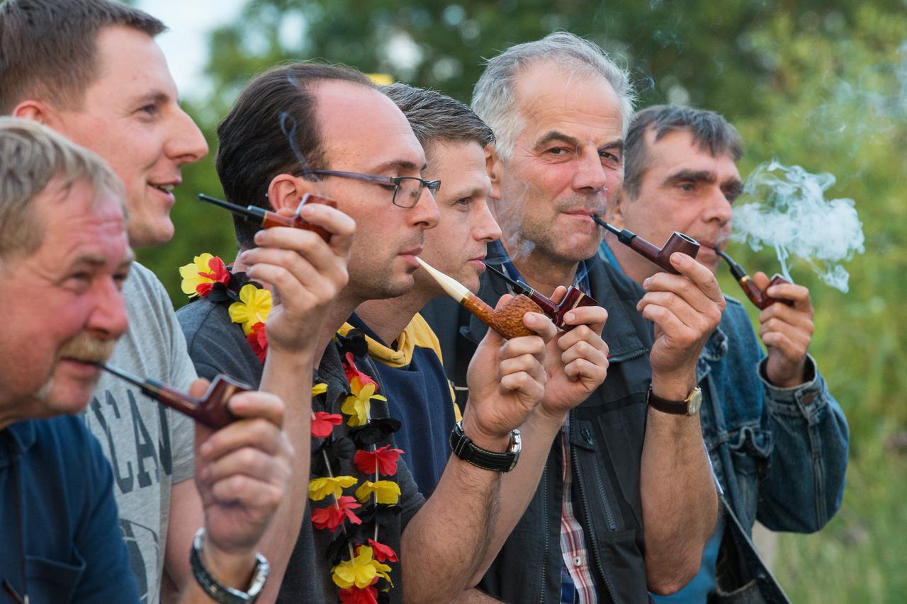 Members of the Pipe-Club-Wriezen competing in smoking a pipe as slow as possible, Wriezen, Germany, 21 June 2016. All members receive one pipe, three gramms of tobacco, a stodger and two matches with which they have to light the pipe within one minute. Pr