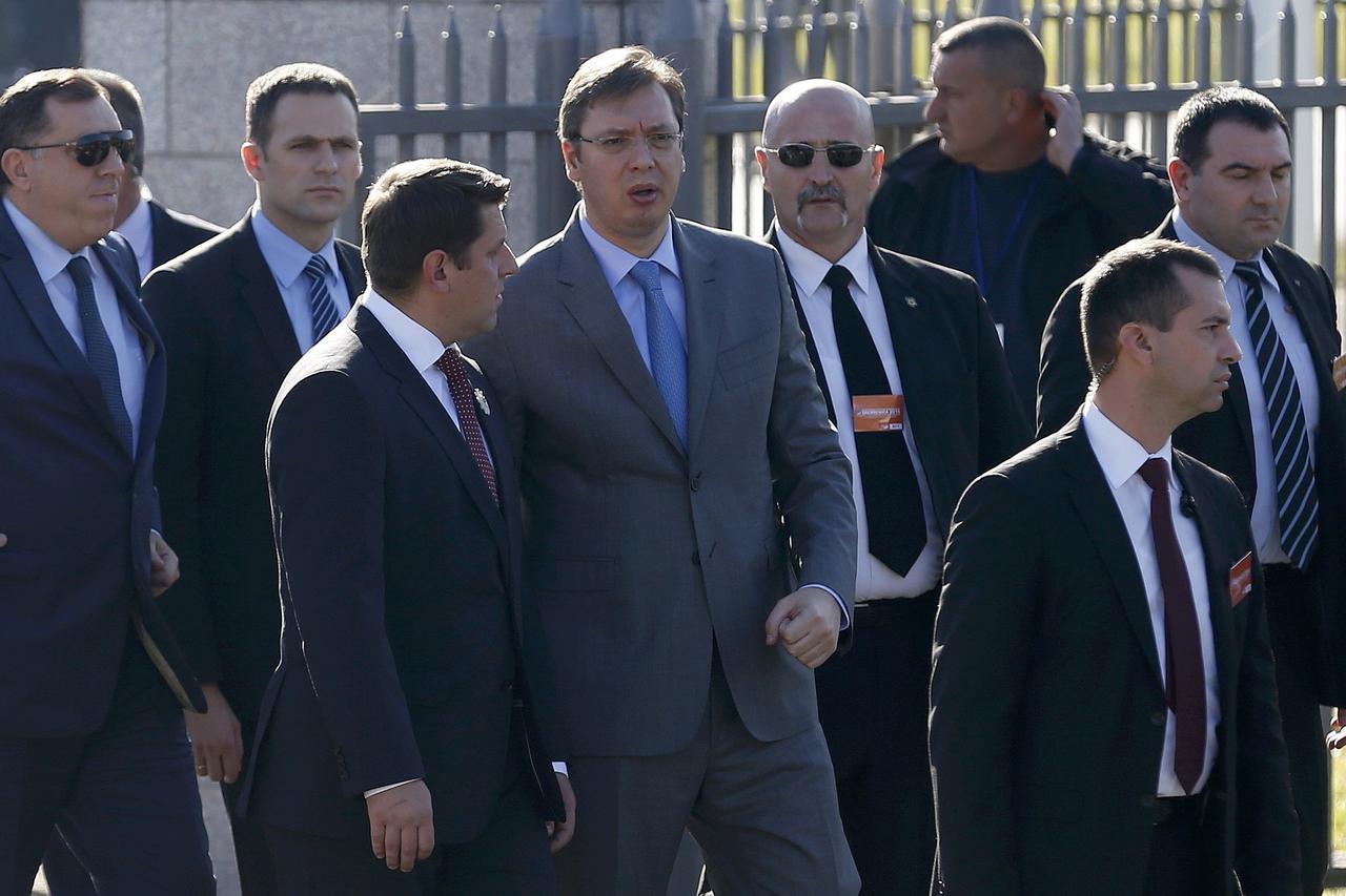 Serbia's Prime Minister Aleksandar Vucic (C) arrives for an official ceremony at the Memorial Center Potocari, near Srebrenica, Bosnia and Herzegovina, November 11, 2015.    REUTERS/Dado Ruvic